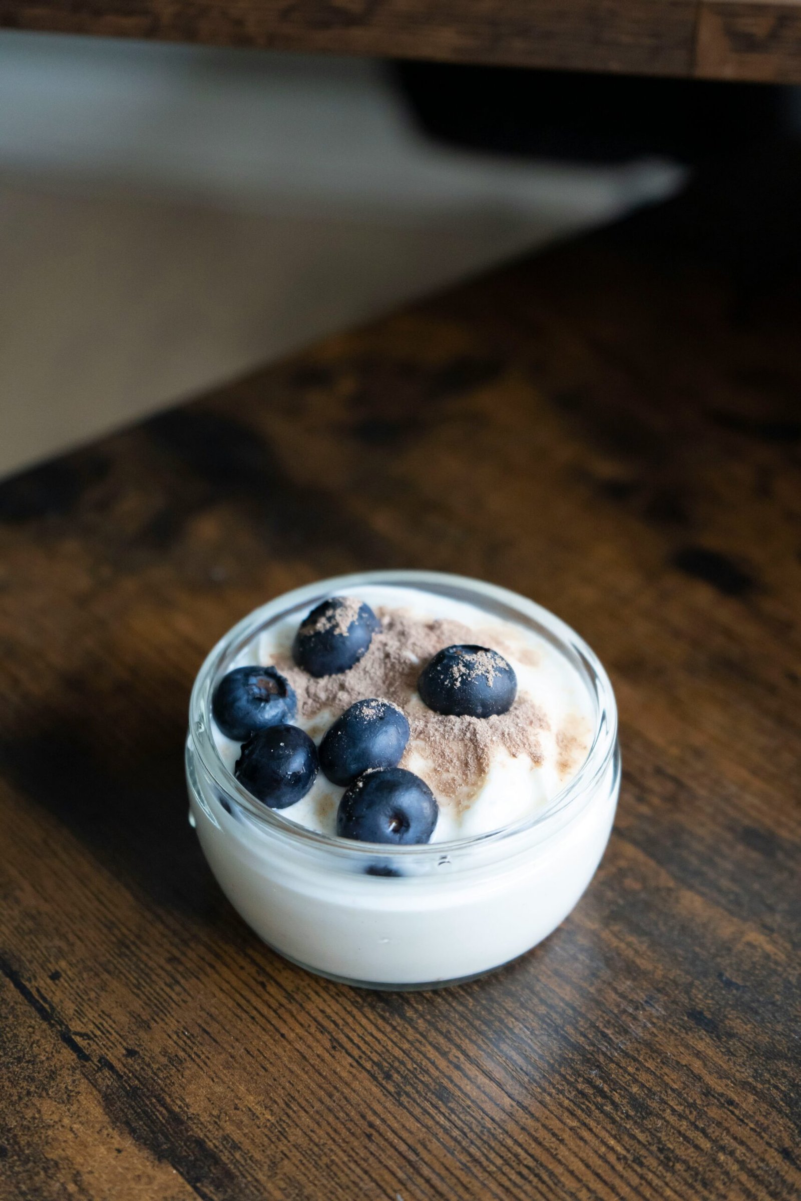 a bowl of ice cream with blueberries on top